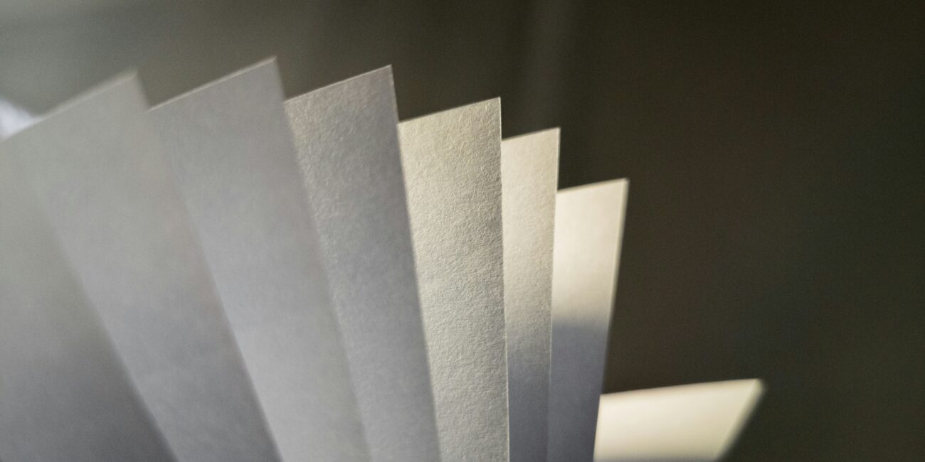 Photo of a paper stack lit by sunlight.