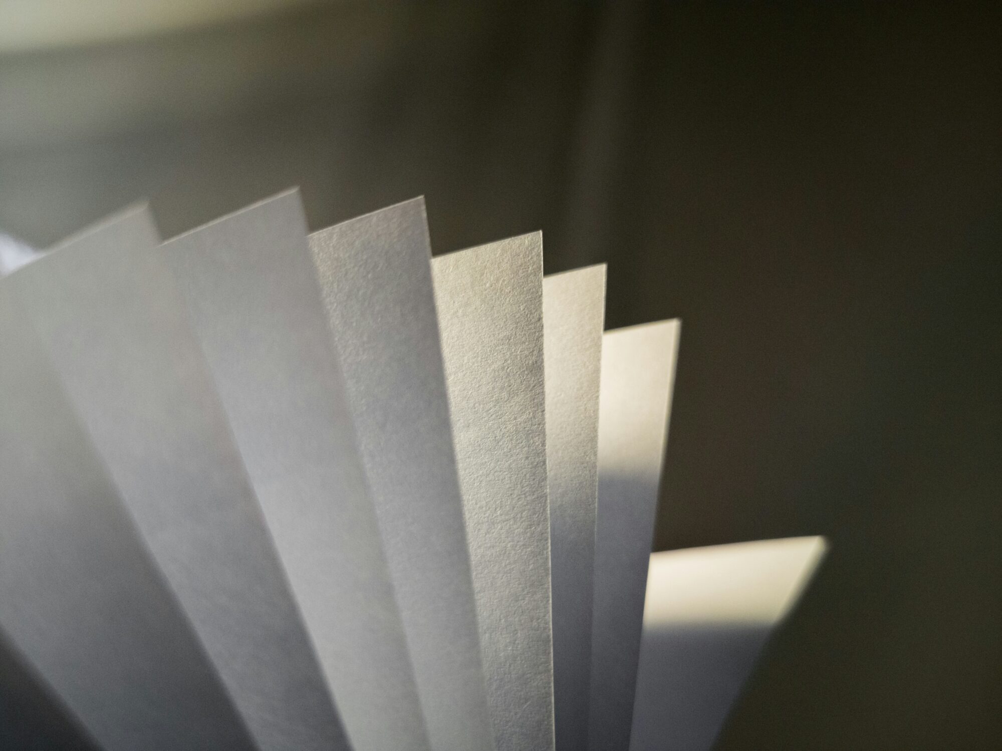 Photo of a paper stack lit by sunlight.